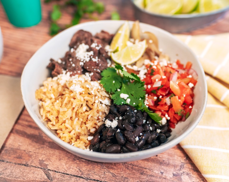 Steak bowl from LIME Fresh Mexican Grill with cilantro, rice, beans, and pico de gallo